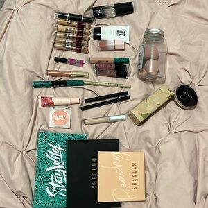 A bundle of a variety makeup products for a complete look.